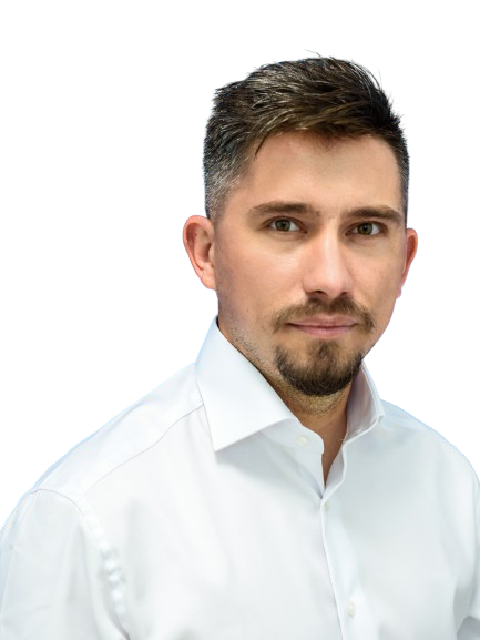 Headshot of a person with short dark hair and beard, wearing a white dress shirt, against a white background